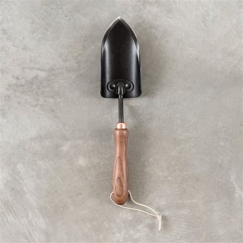 Garden Spade: For digging holes.